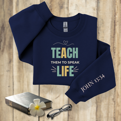 Teach Them to Speak Life Pastel w/Bible Sleeve Verse John 13:34 • Christian Teacher Sweatshirt — Gildan 18000 • Back to School
